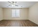 Bedroom with ceiling fan and window at 1170 S Agnes Ln, Gilbert, AZ 85296