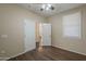 Bedroom with ceiling fan and door to another room at 1170 S Agnes Ln, Gilbert, AZ 85296