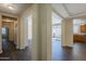 An inviting entryway featuring elegant columns and gleaming dark wood flooring, leading to an open living space at 1170 S Agnes Ln, Gilbert, AZ 85296