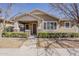 Charming single-story home with a cozy front porch, manicured landscaping, and stone accents at 1170 S Agnes Ln, Gilbert, AZ 85296
