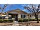 Charming single-story home with stone accents, covered porch, manicured landscaping, and a welcoming entryway at 1170 S Agnes Ln, Gilbert, AZ 85296