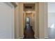 Long hallway with dark wood floors connecting various rooms at 1170 S Agnes Ln, Gilbert, AZ 85296