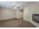 Living room features wood-look floors and a fireplace at 1170 S Agnes Ln, Gilbert, AZ 85296