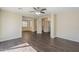 Expansive living area with dark wood floors, connecting seamlessly to the dining area and hallway at 1170 S Agnes Ln, Gilbert, AZ 85296