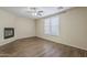 Living room featuring a window, fireplace, and ceiling fan at 1170 S Agnes Ln, Gilbert, AZ 85296