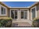 Private patio area featuring sliding glass doors and mature shrubs, perfect for outdoor relaxation at 1170 S Agnes Ln, Gilbert, AZ 85296