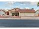 Inviting single-story home with a red-tiled roof, desert landscaping, and a convenient two-car garage at 12837 S 41St St, Phoenix, AZ 85044