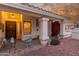 Cozy front porch with seating, a decorative gate, and desert landscaping, welcoming you home at 12837 S 41St St, Phoenix, AZ 85044