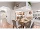 Open kitchen showcasing a breakfast bar with seating and a view into the living room at 12837 S 41St St, Phoenix, AZ 85044