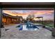 Open backyard with a pool, hot tub, and barbecue grill, for a peaceful and entertaining evening at 13018 S 177Th Ln, Goodyear, AZ 85338