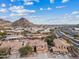 Expansive aerial view of desert homes surrounded by beautiful mountain views and a scenic neighborhood at 1307 E Desert Broom Way, Phoenix, AZ 85048