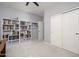 Bedroom features a large bookcase and closet offering ample storage at 16038 W Acapulco Ln, Surprise, AZ 85379