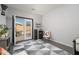 Bonus room featuring a built-in bar and sliding glass doors leading to the patio at 16038 W Acapulco Ln, Surprise, AZ 85379