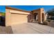 Lovely single-story home showcasing a well-maintained front yard with a two-car attached garage at 16038 W Acapulco Ln, Surprise, AZ 85379