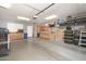 Spacious garage featuring built in cabinetry and ample storage space at 16038 W Acapulco Ln, Surprise, AZ 85379