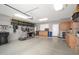Well-organized garage features built in cabinetry and ample storage space at 16038 W Acapulco Ln, Surprise, AZ 85379