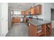 Well-appointed kitchen with stainless steel appliances, custom cabinets, and a functional center island at 16038 W Acapulco Ln, Surprise, AZ 85379