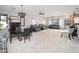 Open-concept living room with stylish furnishings, neutral tones, and plenty of space for entertaining at 16038 W Acapulco Ln, Surprise, AZ 85379