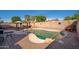 Sparkling pool with surrounding brick patio and shaded gazebo provides a backyard oasis at 16038 W Acapulco Ln, Surprise, AZ 85379