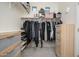 Walk-in closet with shelving and ample storage space at 16038 W Acapulco Ln, Surprise, AZ 85379
