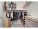 Walk-in closet with ample storage space and shelving at 16038 W Acapulco Ln, Surprise, AZ 85379