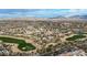 Picturesque aerial view of the Estrella community showing golf course, desert landscaping, homes, and distant mountain views at 18143 W Buckhorn Dr, Goodyear, AZ 85338