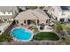 Aerial view of backyard with a pool, turf, spa, and desert landscaping, providing a private and luxurious outdoor space at 18143 W Buckhorn Dr, Goodyear, AZ 85338