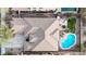 Aerial view of a home with a backyard oasis with a pool, hot tub, and desert landscaping at 18143 W Buckhorn Dr, Goodyear, AZ 85338