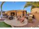 Spacious backyard with outdoor dining, grill, seating and hot tub, perfect for outdoor gatherings and relaxation at 18143 W Buckhorn Dr, Goodyear, AZ 85338