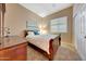 Bedroom with a bed, window, and closet with sliding doors at 18143 W Buckhorn Dr, Goodyear, AZ 85338