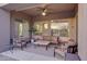 Inviting covered patio with comfortable seating and stylish decor, ideal for enjoying the outdoors in comfort at 18143 W Buckhorn Dr, Goodyear, AZ 85338