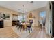 Inviting dining room featuring a fireplace, decorative mirror, and comfortable seating at 18143 W Buckhorn Dr, Goodyear, AZ 85338