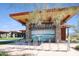 A welcoming entrance to Estrella Lakes featuring stone accents and modern design elements at 18143 W Buckhorn Dr, Goodyear, AZ 85338