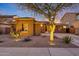 Charming single-story home featuring desert landscaping, stone accents, and a welcoming walkway to the front door at 18143 W Buckhorn Dr, Goodyear, AZ 85338