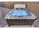 Inviting hot tub perfect for relaxation, nestled in a low maintenance desert landscaped backyard at 18143 W Buckhorn Dr, Goodyear, AZ 85338