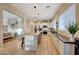 Bright kitchen with a spacious island, pendant lighting, and a seamless transition to the adjacent living space at 18143 W Buckhorn Dr, Goodyear, AZ 85338