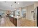 Stylish kitchen boasting a central island, stainless steel appliances, and views into the adjacent dining and living areas at 18143 W Buckhorn Dr, Goodyear, AZ 85338
