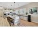 Modern kitchen featuring a large island with seating, stainless steel appliances, and ample counter space at 18143 W Buckhorn Dr, Goodyear, AZ 85338