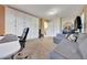 Versatile space with desk, sofa, and ample storage, ideal for office or den at 18143 W Buckhorn Dr, Goodyear, AZ 85338