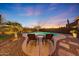 Relaxing poolside view with lounge chairs, desert landscaping, and a serene ambiance offers the perfect outdoor retreat at 18143 W Buckhorn Dr, Goodyear, AZ 85338