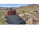 Architectural tower and community gathering place with cascading waterfall and stream in a desert setting at 18143 W Buckhorn Dr, Goodyear, AZ 85338