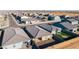 An aerial shot of a new community showcasing modern homes with well-kept yards at 18224 N Toledo Ave, Maricopa, AZ 85138