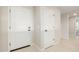 Home foyer featuring white doors, neutral walls, and ceramic floors at 18224 N Toledo Ave, Maricopa, AZ 85138