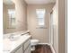 Cozy bathroom with shower, wood-look vinyl flooring, and neutral color palette at 19601 N 99Th Dr, Sun City, AZ 85373