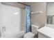 Clean bathroom with a combined shower-tub, new toilet, and decoratively patterned curtain at 20100 N 78Th Pl # 2098, Scottsdale, AZ 85255