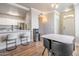 Dining room with a marble table, modern chairs, and a view into the kitchen at 20100 N 78Th Pl # 2098, Scottsdale, AZ 85255