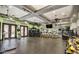 Well-equipped gym area features fans, mirrors, exercise bikes, weights, and other fitness equipment at 20100 N 78Th Pl # 2098, Scottsdale, AZ 85255