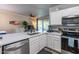 Bright kitchen with stainless steel dishwasher and sink with a view to outdoor patio at 20100 N 78Th Pl # 2098, Scottsdale, AZ 85255
