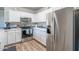 Bright kitchen with stainless steel appliances, white cabinets, and blue backsplash at 20100 N 78Th Pl # 2098, Scottsdale, AZ 85255