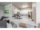 Modern kitchen featuring white cabinets, stainless steel appliances, and a breakfast bar at 20100 N 78Th Pl # 2098, Scottsdale, AZ 85255
